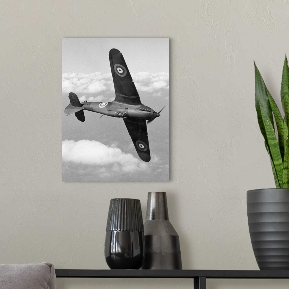 A modern room featuring A Hawker Hurricane fighter photographed in August 1940 while banking.