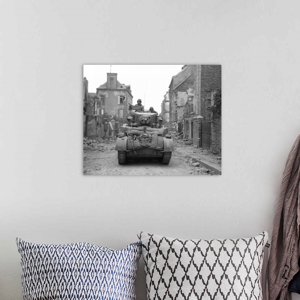 A bohemian room featuring An American tank moving through liberated Saint-Lo, Normandy, France, July 20, 1944.