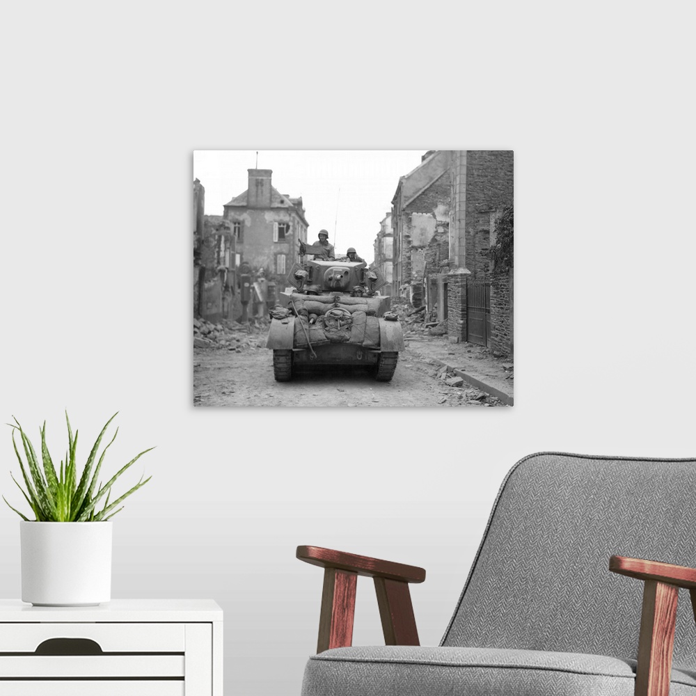 A modern room featuring An American tank moving through liberated Saint-Lo, Normandy, France, July 20, 1944.