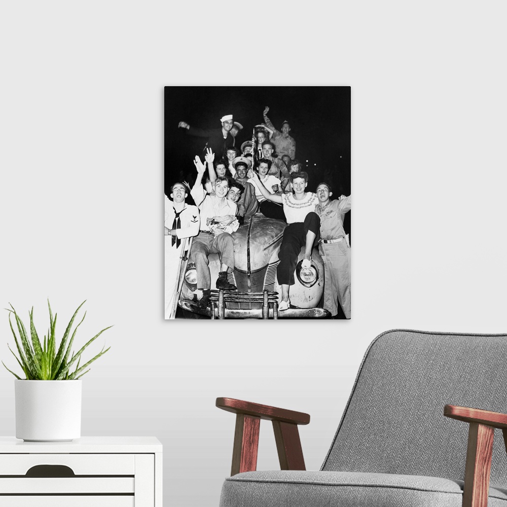 A modern room featuring A group of people in Washington D.C. celebrating the Japanese surrender to Allied forces. Photogr...
