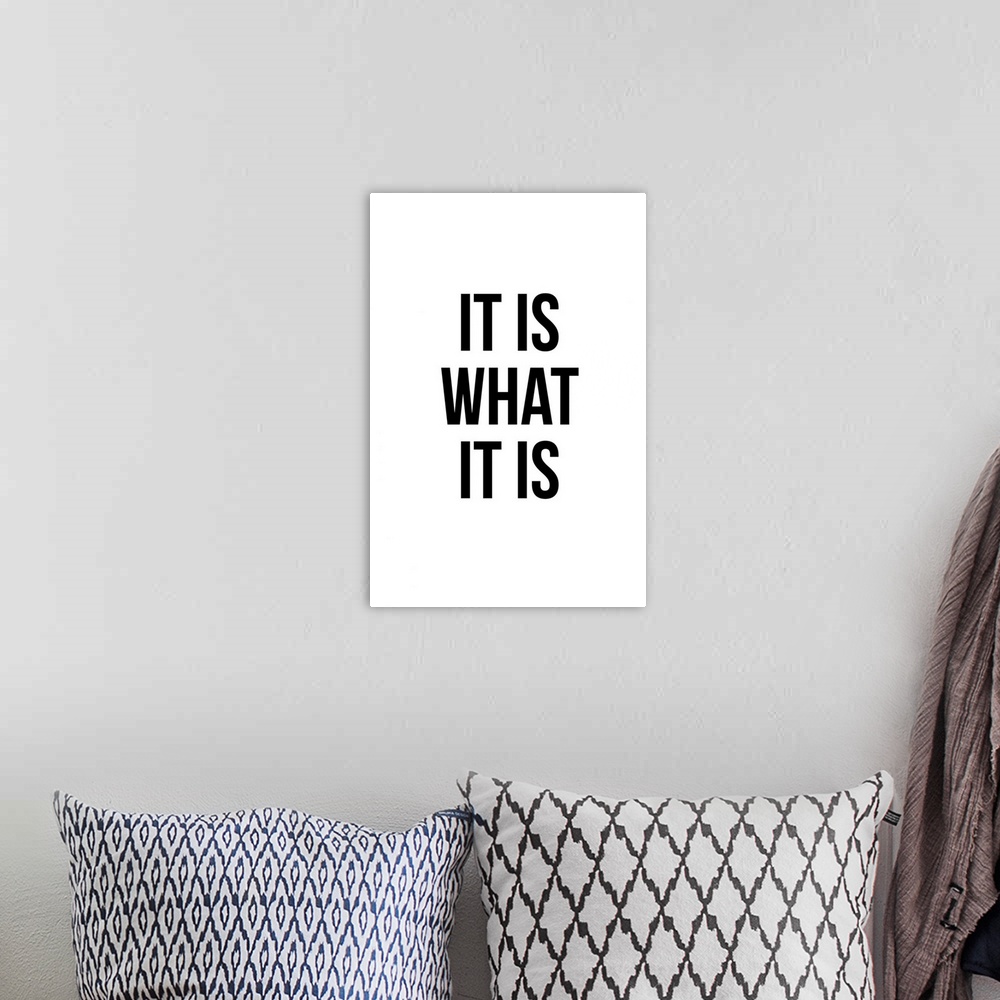 A bohemian room featuring "It Is What It Is" in black, on a white background.