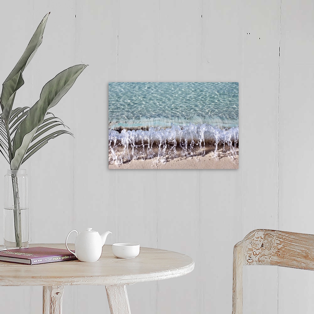 A farmhouse room featuring Photograph of a small wave hitting the shore of a beach.