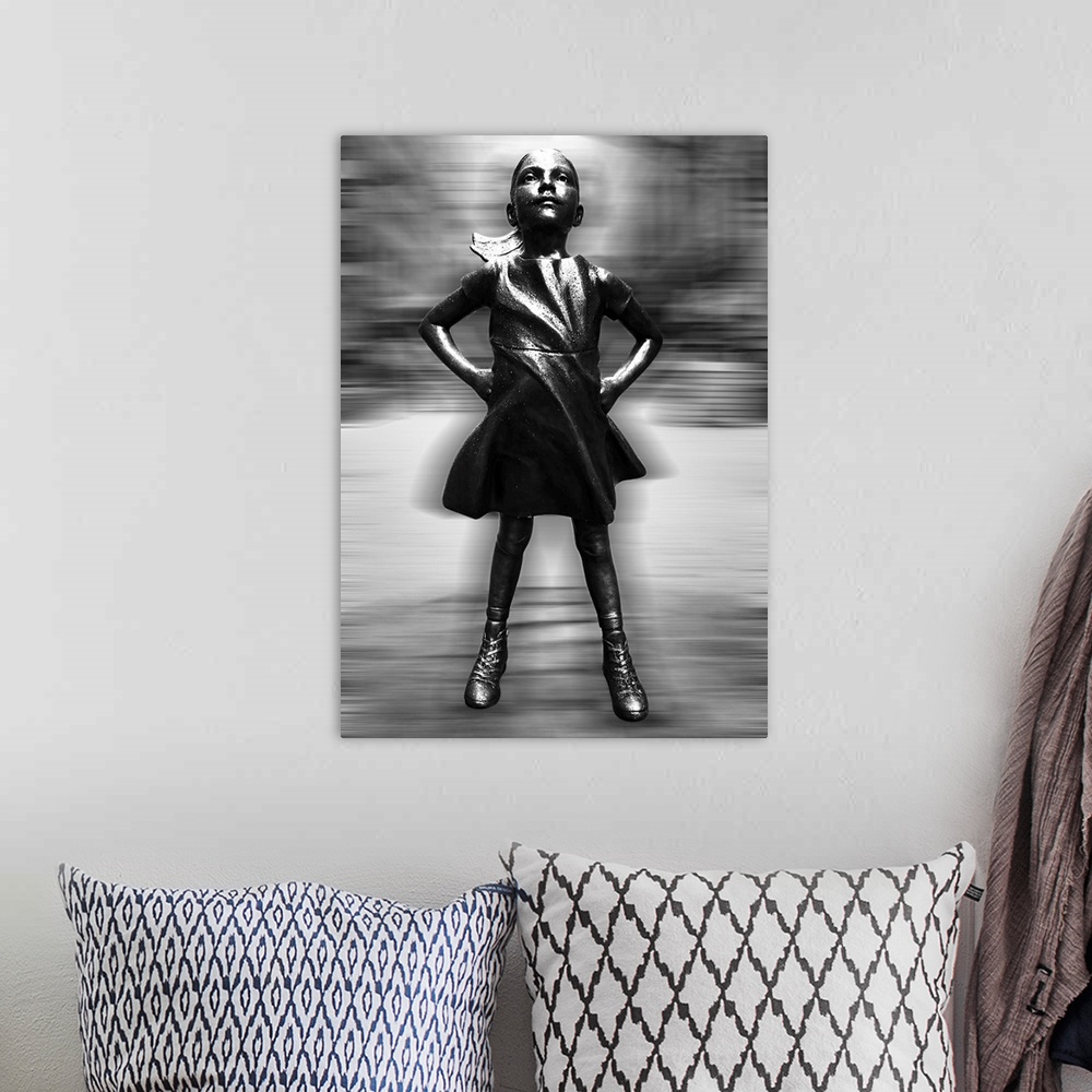 A bohemian room featuring Black and white vertical image of a girl statue with her hands on her hips, with a blurred motion...