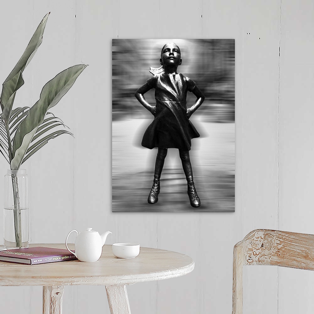 A farmhouse room featuring Black and white vertical image of a girl statue with her hands on her hips, with a blurred motion...