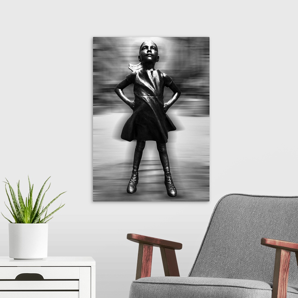 A modern room featuring Black and white vertical image of a girl statue with her hands on her hips, with a blurred motion...