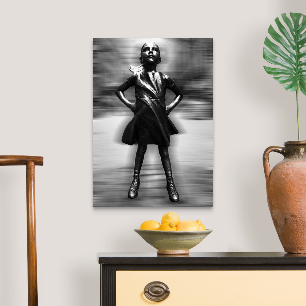 A traditional room featuring Black and white vertical image of a girl statue with her hands on her hips, with a blurred motion...