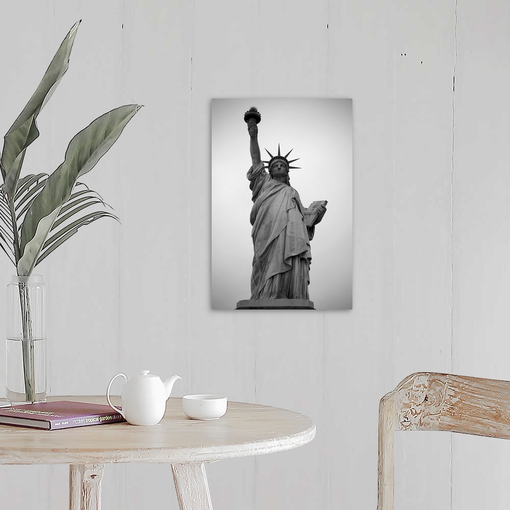 A farmhouse room featuring A black and white photograph of the Statue of Liberty.
