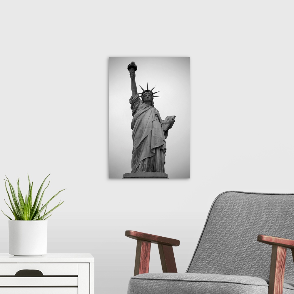 A modern room featuring A black and white photograph of the Statue of Liberty.