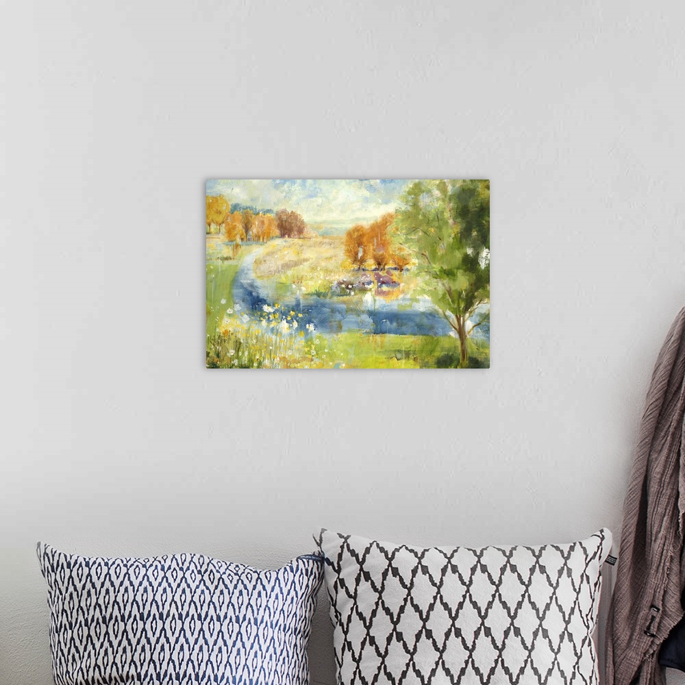 A bohemian room featuring Contemporary landscape painting looking out over countryside.