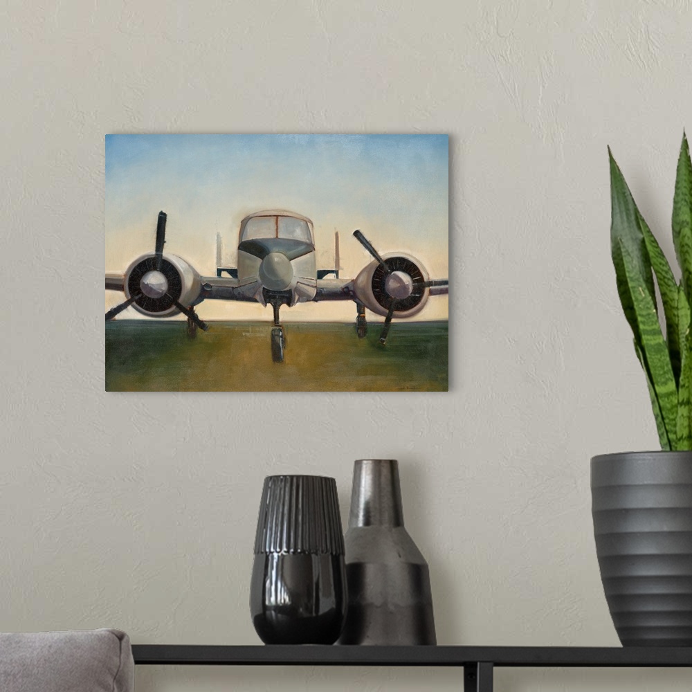 A modern room featuring A painting of an airplane preparing to take off on a runway.