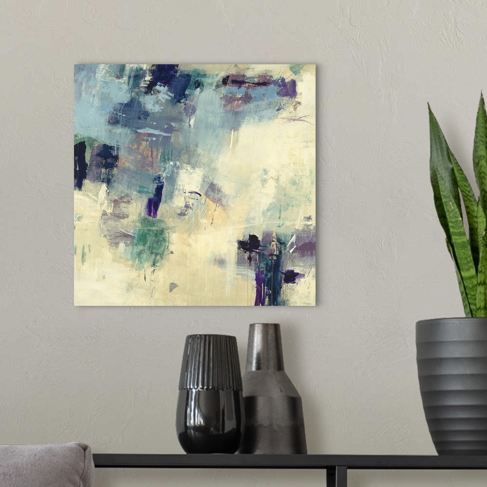A modern room featuring Contemporary abstract painting using a balance of cream and dark blue and purple colors.
