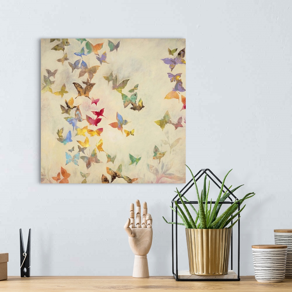 A bohemian room featuring Contemporary painting of fluttering butterflies in a spectrum of colors against a cream background.