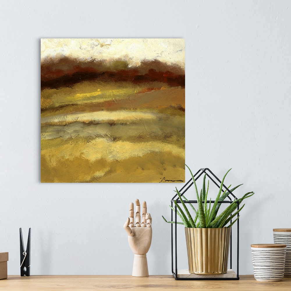 A bohemian room featuring Contemporary painting of a golden earthy toned landscape.