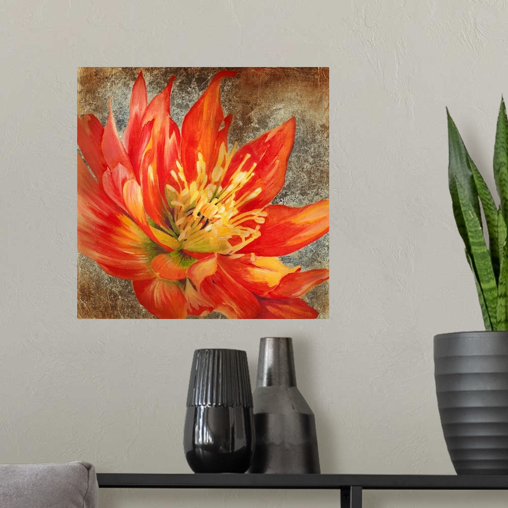 A modern room featuring Square artwork of a large red flower with yellow details on a metallic bronze background.