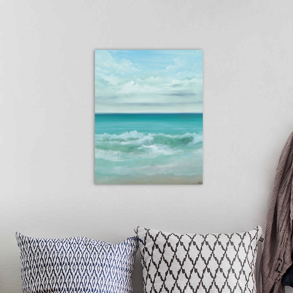 A bohemian room featuring A painting of a crystal blue seascape.