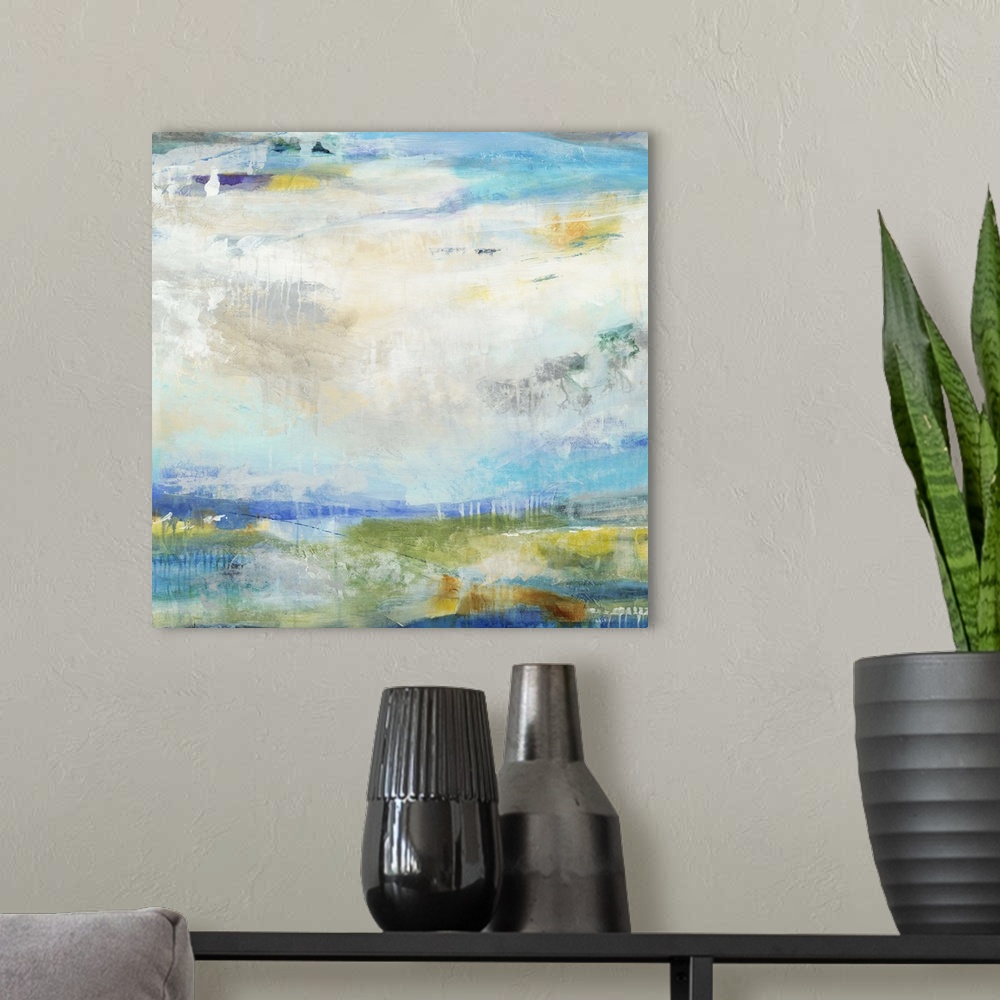 A modern room featuring A contemporary abstract painting using predominantly blue tones to convey an abstracted landscape.