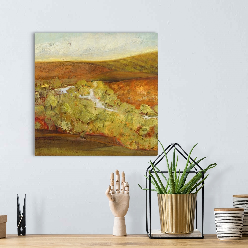 A bohemian room featuring Contemporary landscape painting looking out over autumn countryside.