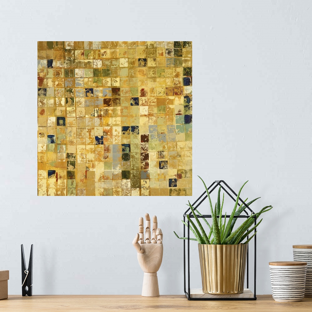 A bohemian room featuring Home decor artwork of a gold and earth toned mosaic.