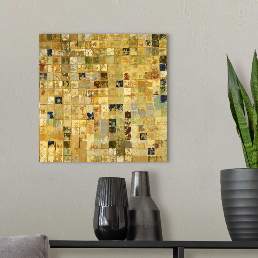 A modern room featuring Home decor artwork of a gold and earth toned mosaic.