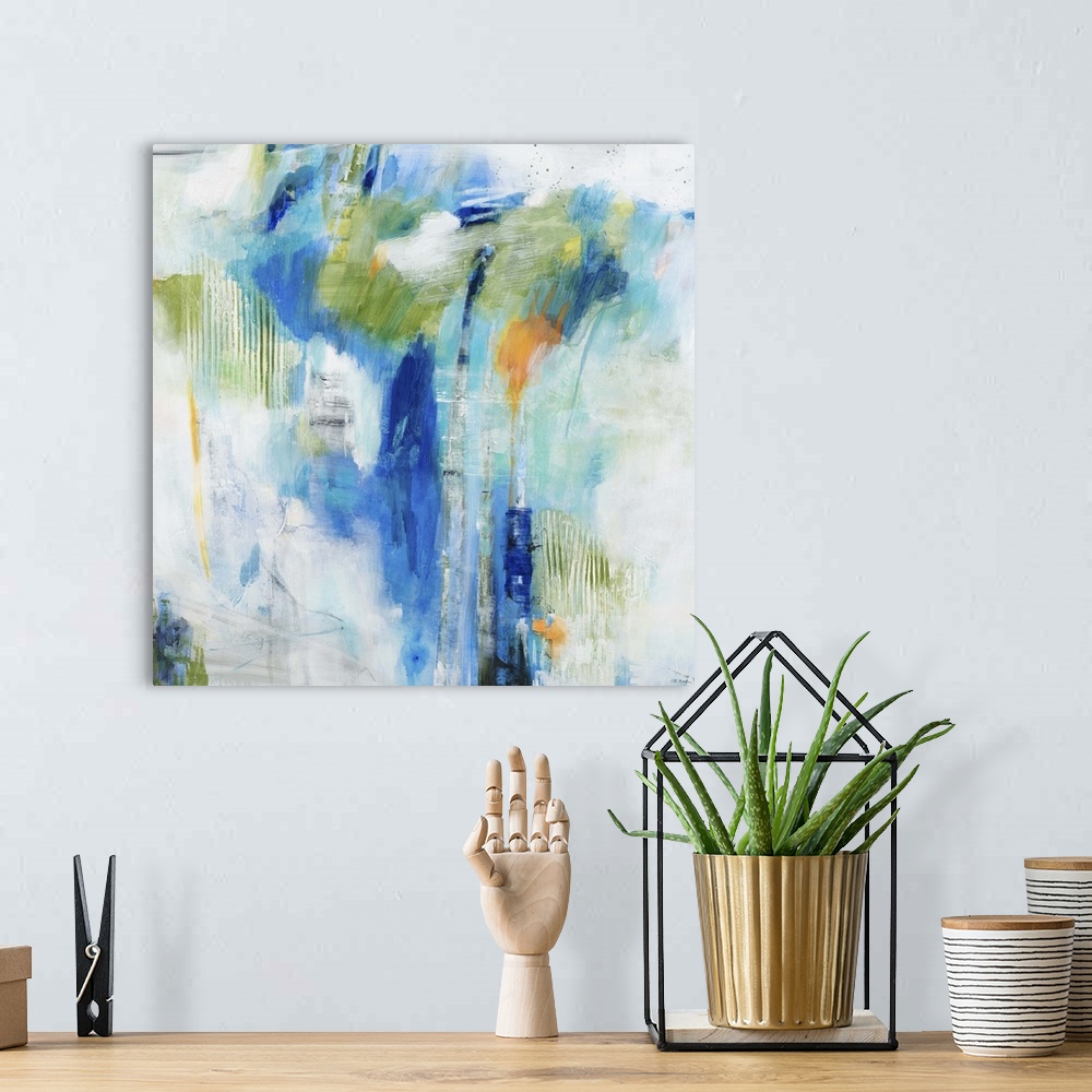 A bohemian room featuring Contemporary abstract painting of splashes blue and green tones against a neutral background.
