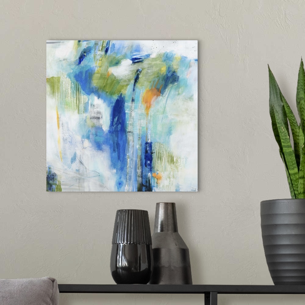 A modern room featuring Contemporary abstract painting of splashes blue and green tones against a neutral background.