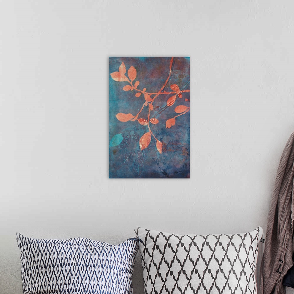 A bohemian room featuring A stunning contemporary cyanotype image featruing coral colored branches against a blue and rust ...