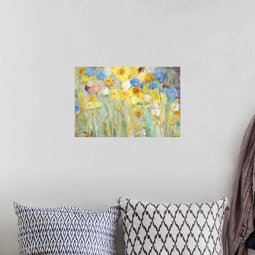 A bohemian room featuring A contemporary painting of a garden of blue and yellow flowers.