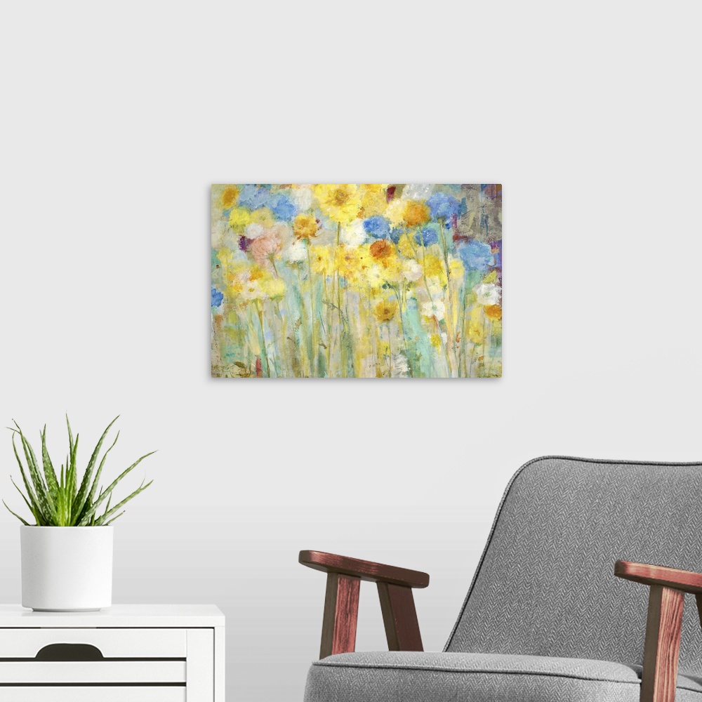 A modern room featuring A contemporary painting of a garden of blue and yellow flowers.