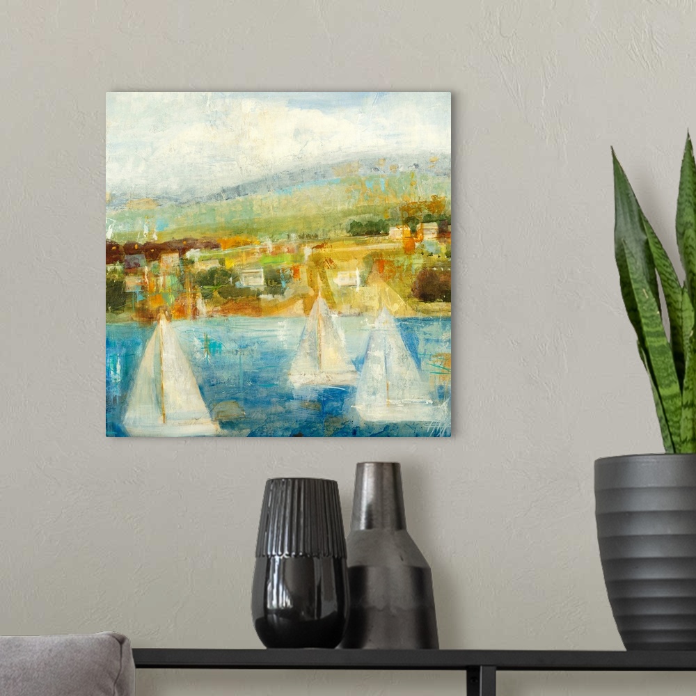A modern room featuring Painting of sailboats in water with city in distance under a cloudy sky.