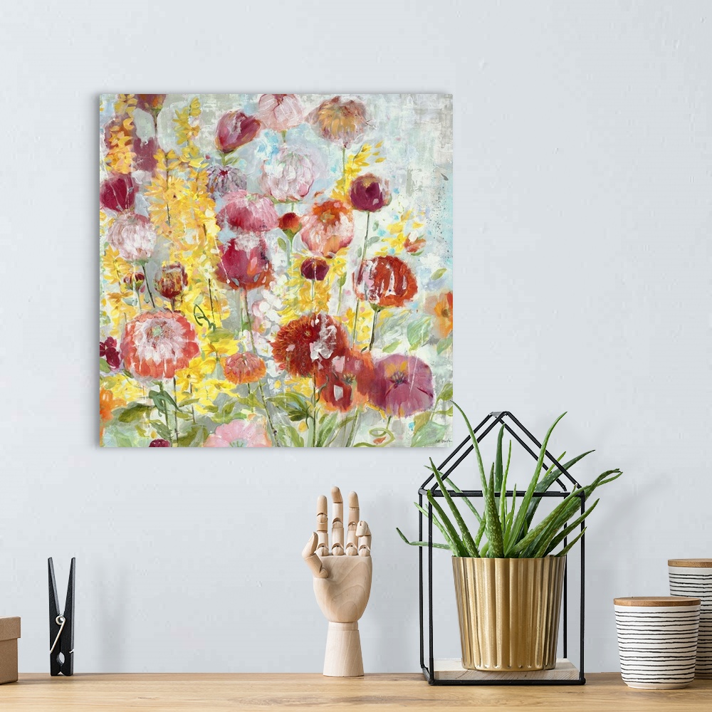 A bohemian room featuring A contemporary painting of vibrant garden flowers against a pale blue background.