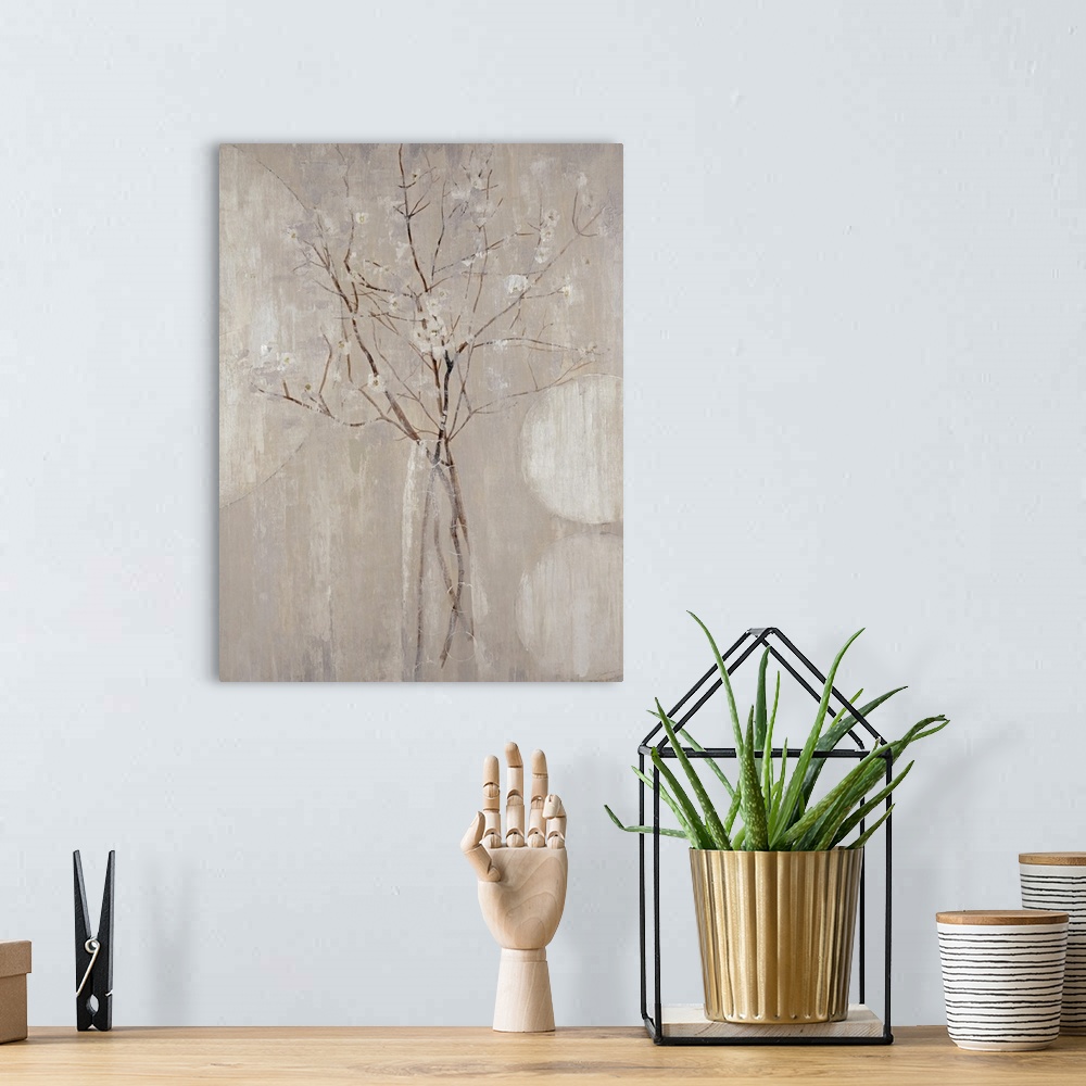 A bohemian room featuring A monochromatic vertical painting of  twigs with tiny flowers.