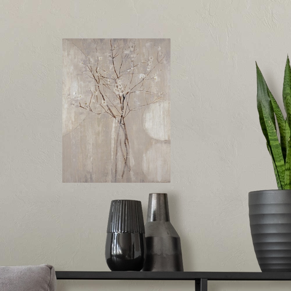 A modern room featuring A monochromatic vertical painting of  twigs with tiny flowers.
