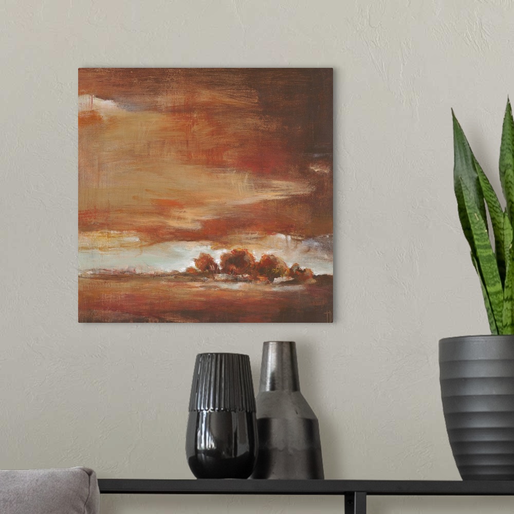A modern room featuring Contemporary landscape painting in autumn colors under a red sky.
