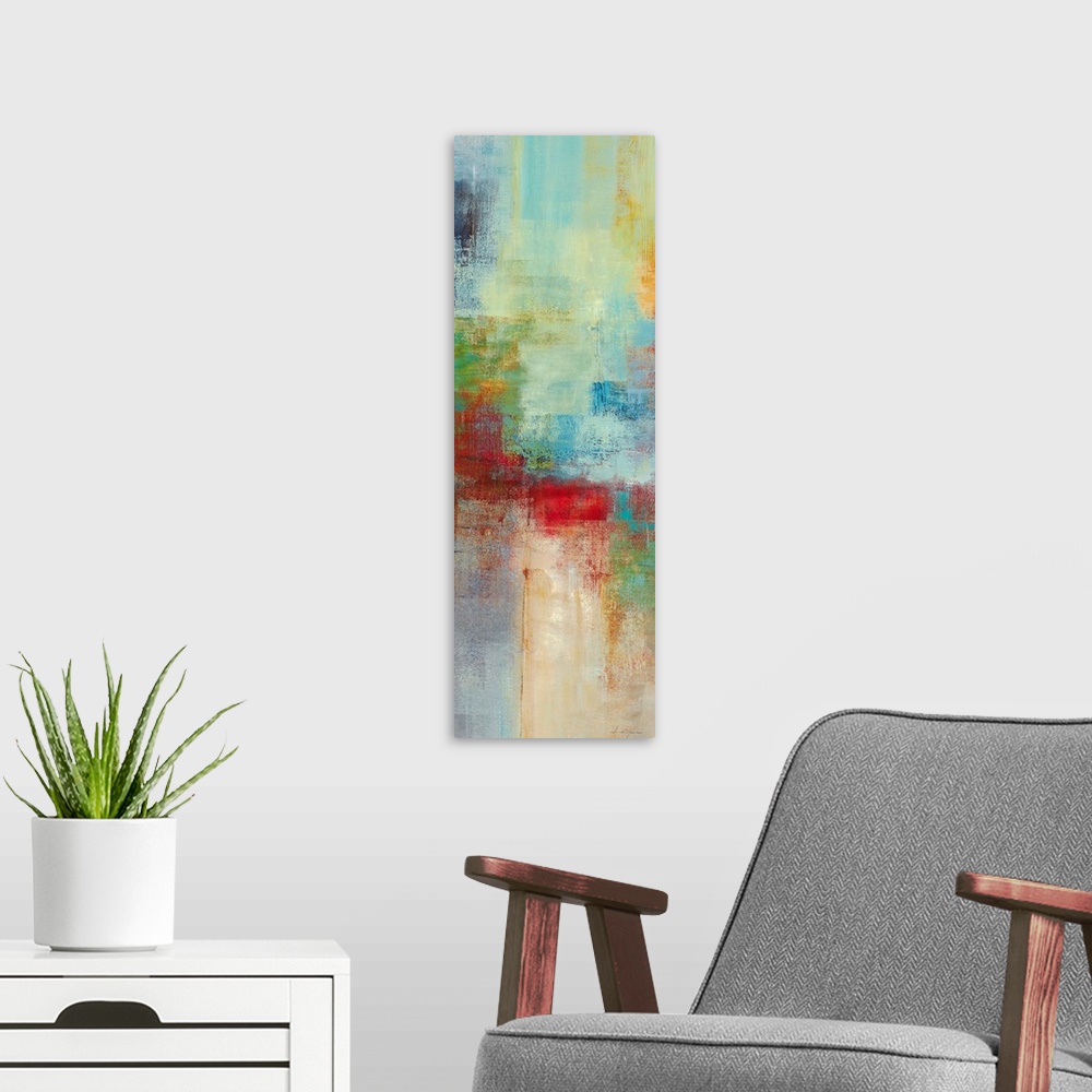 A modern room featuring A narrow piece of abstract artwork that is filled with mostly cool blocks of colors and a pop of ...