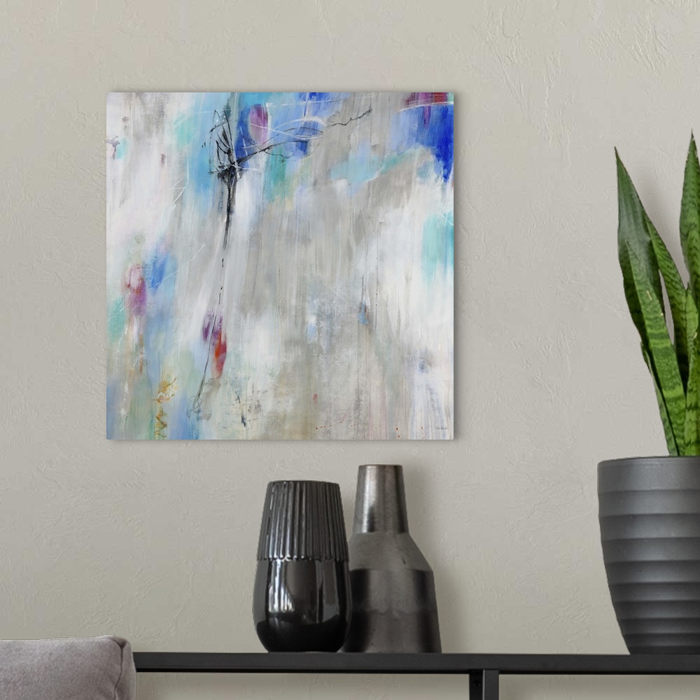 A modern room featuring A contemporary abstract painting using splashes of light blue against a neutral background.