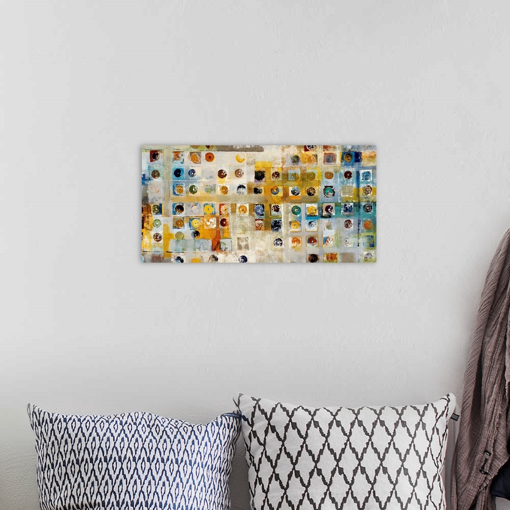 A bohemian room featuring This is a horizontal, abstracting painting of a grid of shapes filled with circles and squares.