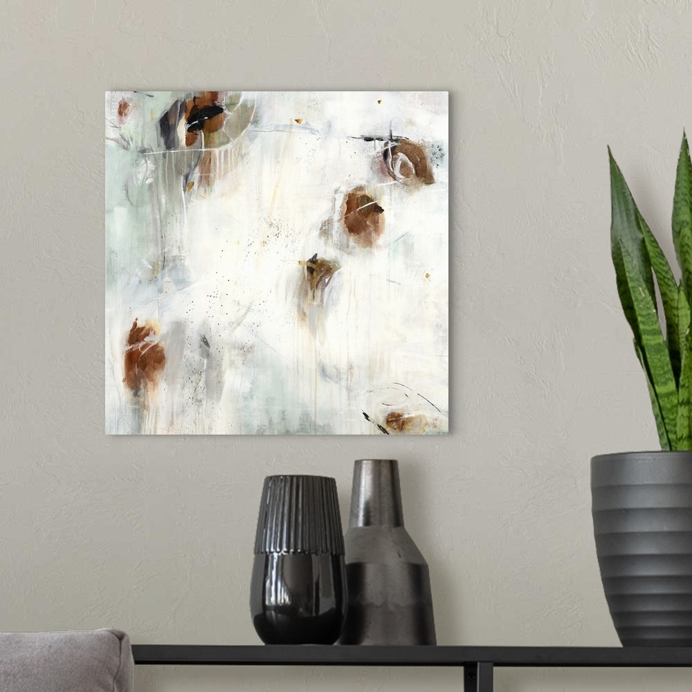 A modern room featuring A contemporary abstract painting using splashes of brown against a neutral background.