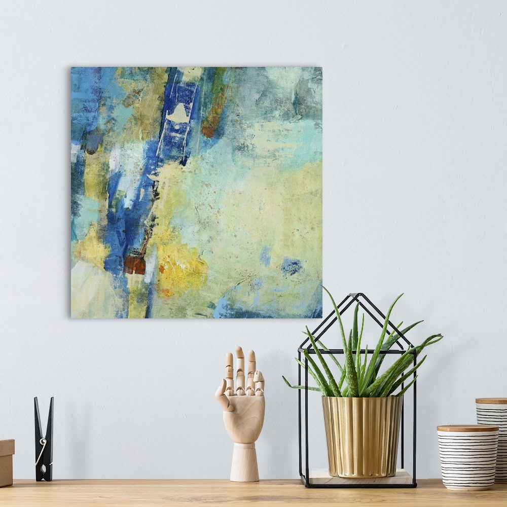 A bohemian room featuring Contemporary abstract painting using mostly blue tones with patches of pale yellow.