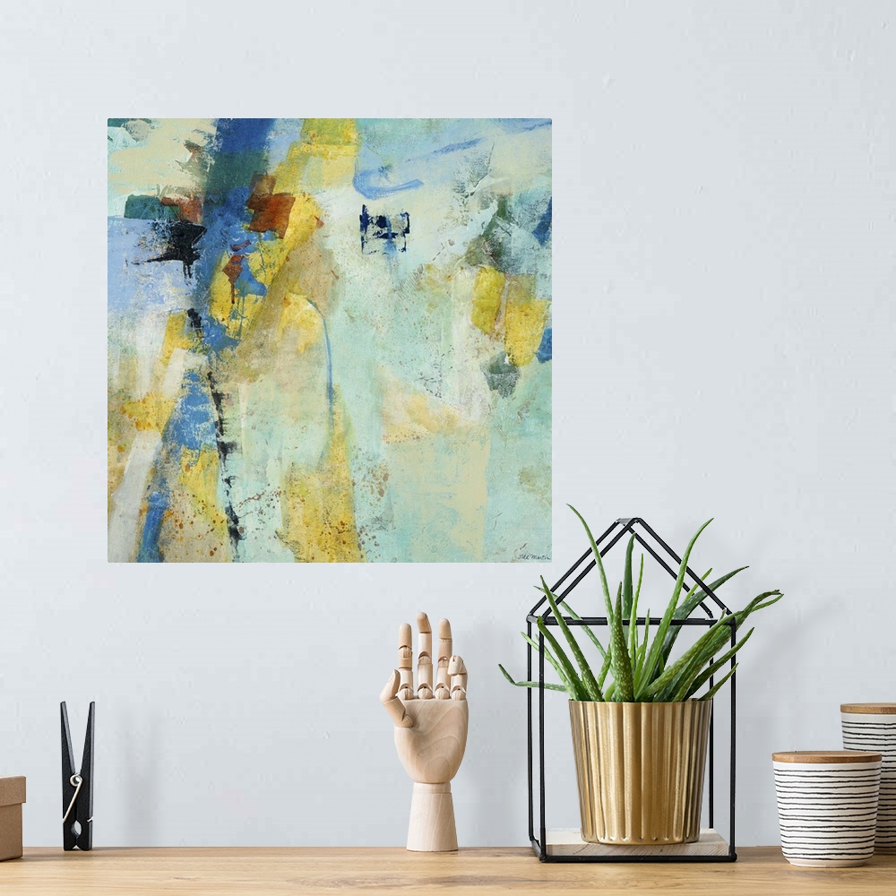 A bohemian room featuring Contemporary abstract painting using mostly blue tones with patches of pale yellow.