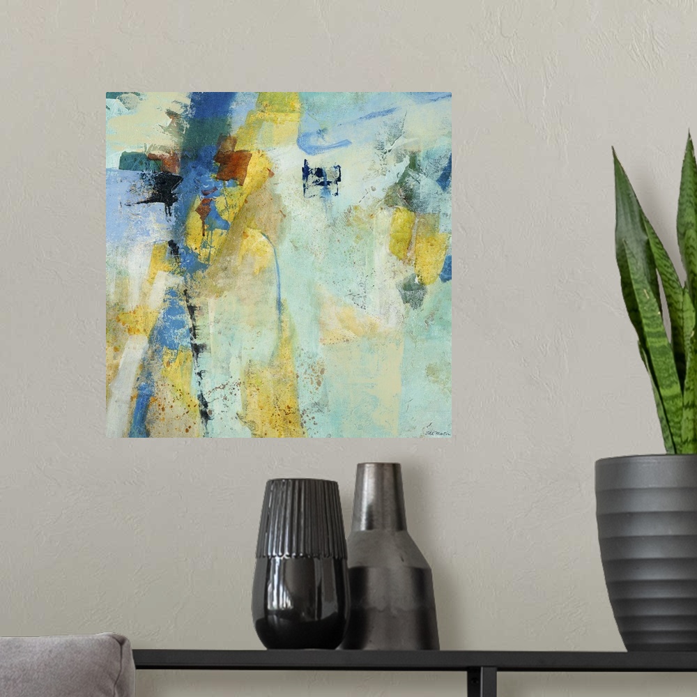 A modern room featuring Contemporary abstract painting using mostly blue tones with patches of pale yellow.