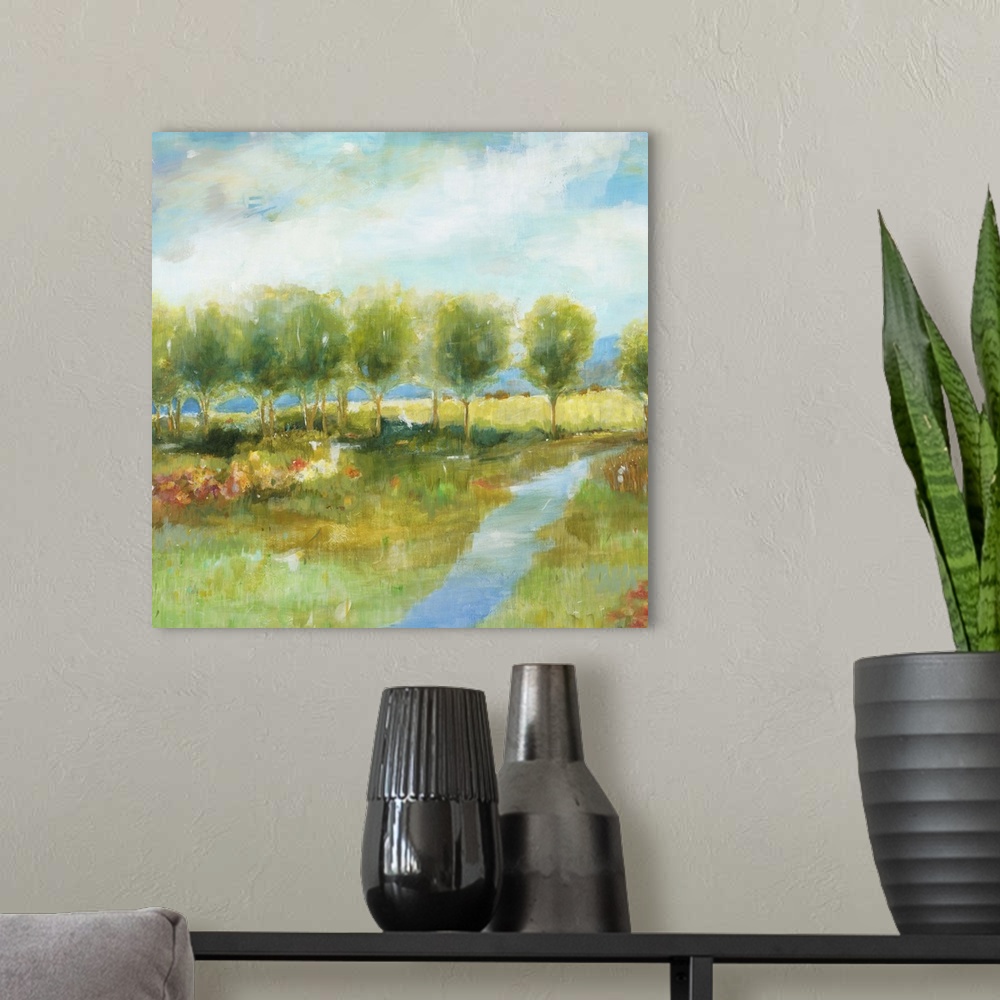 A modern room featuring Contemporary landscape painting with a line of bright green trees.