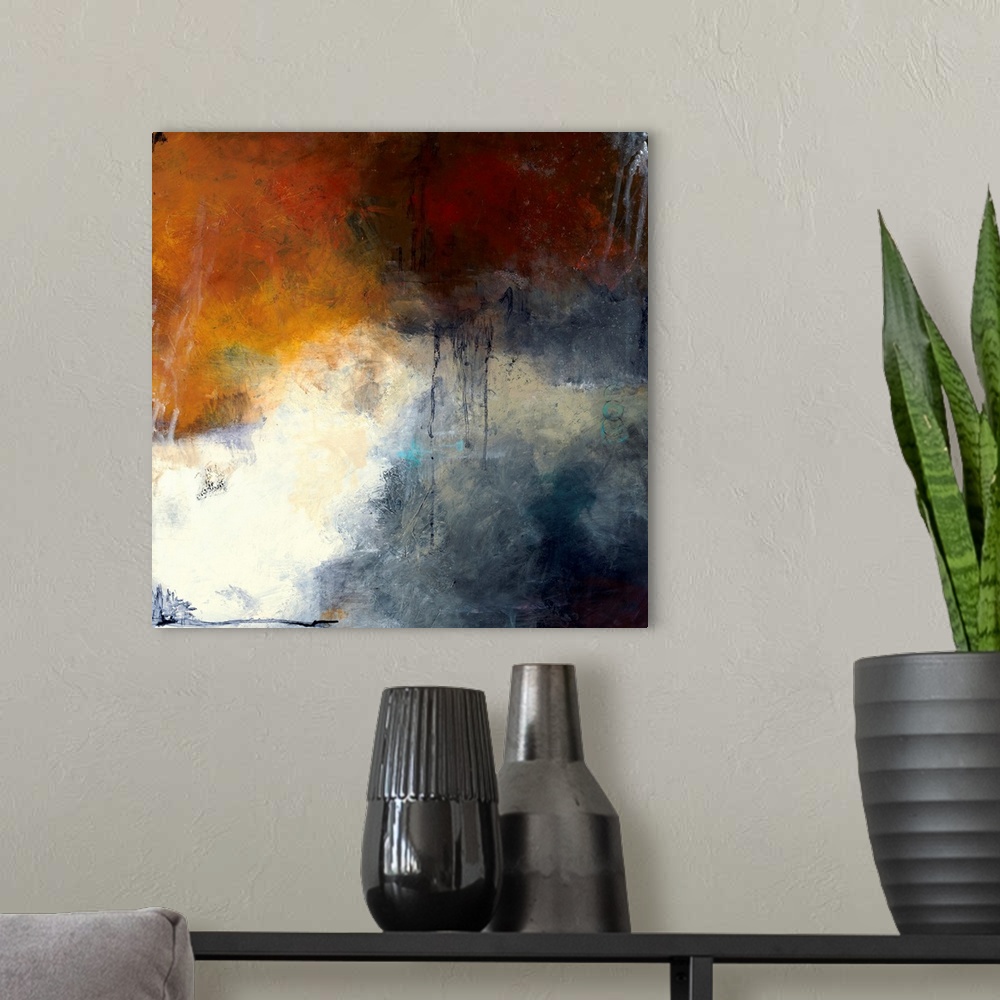 A modern room featuring Square abstract painting with splotches of deep red, orange, and blue hues and a pop of bright wh...