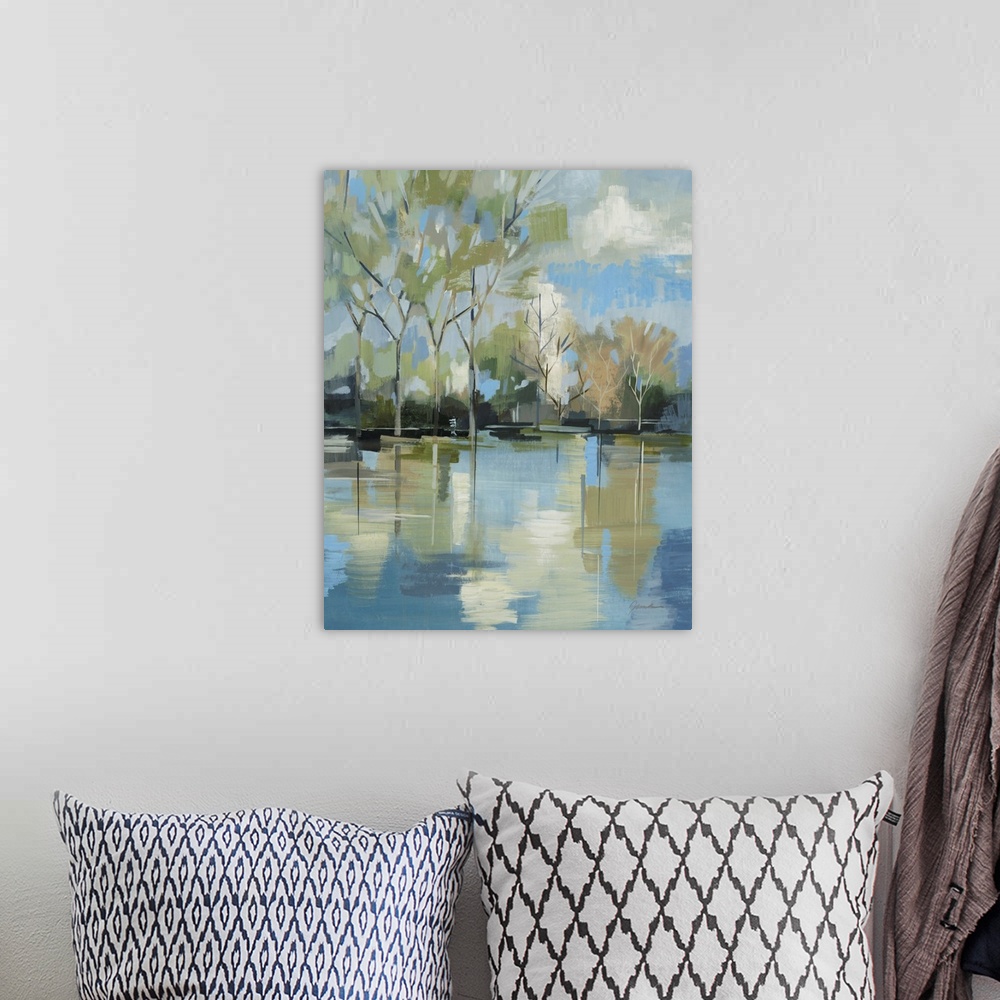 A bohemian room featuring A serene contemporary painting of trees behind a lake painted in a blocky abstract style