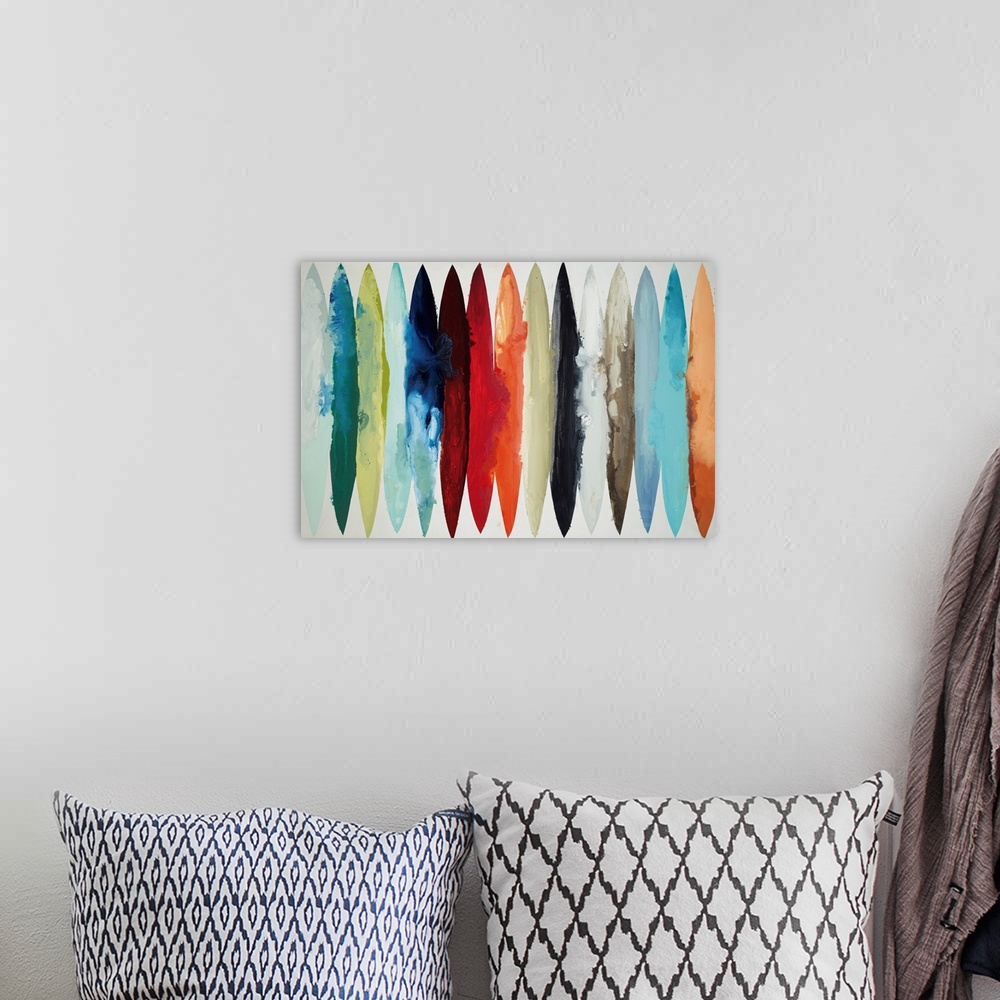 A bohemian room featuring Contemporary abstract painting using oblong shapes in various colors.