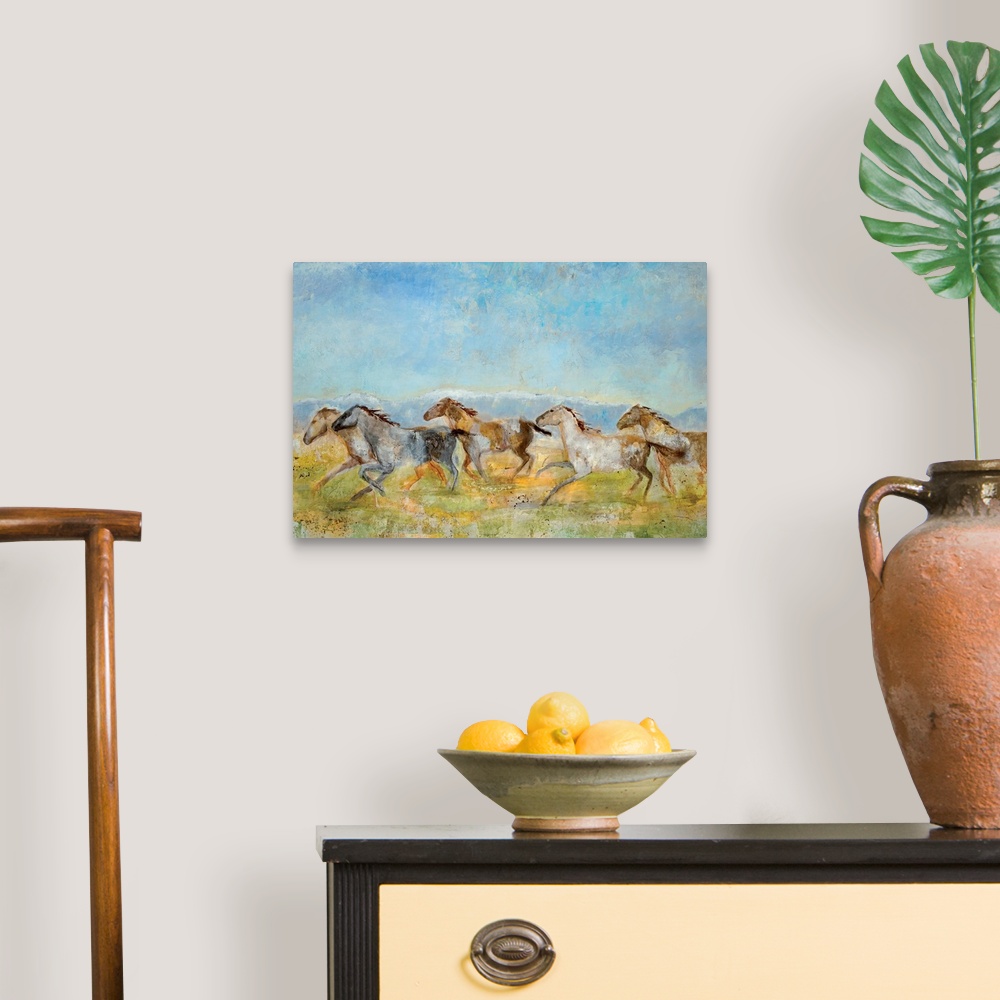 A traditional room featuring A landscape painting of wild horses running across the plains; the horses have been painted with ...