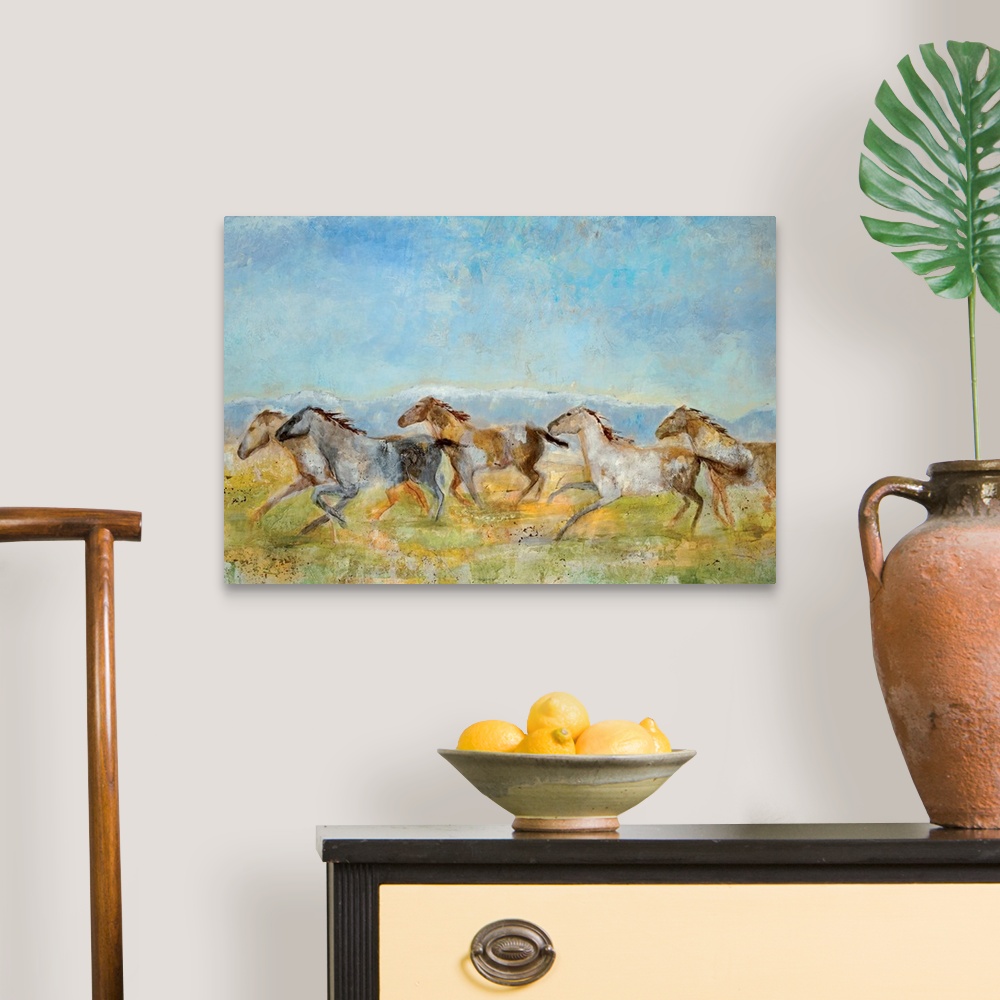 A traditional room featuring A landscape painting of wild horses running across the plains; the horses have been painted with ...