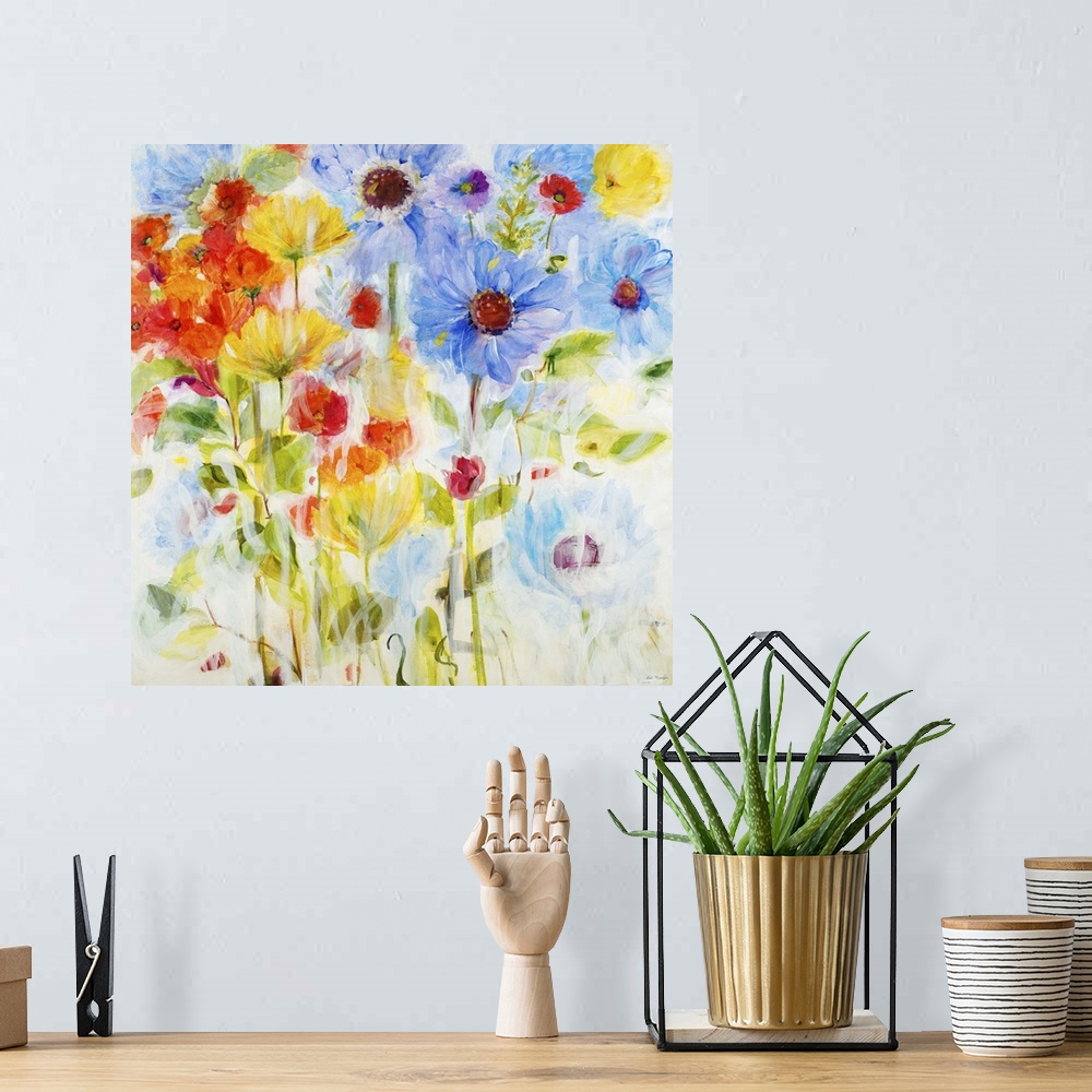 A bohemian room featuring Contemporary painting of vibrant blue yellow and red flowers.