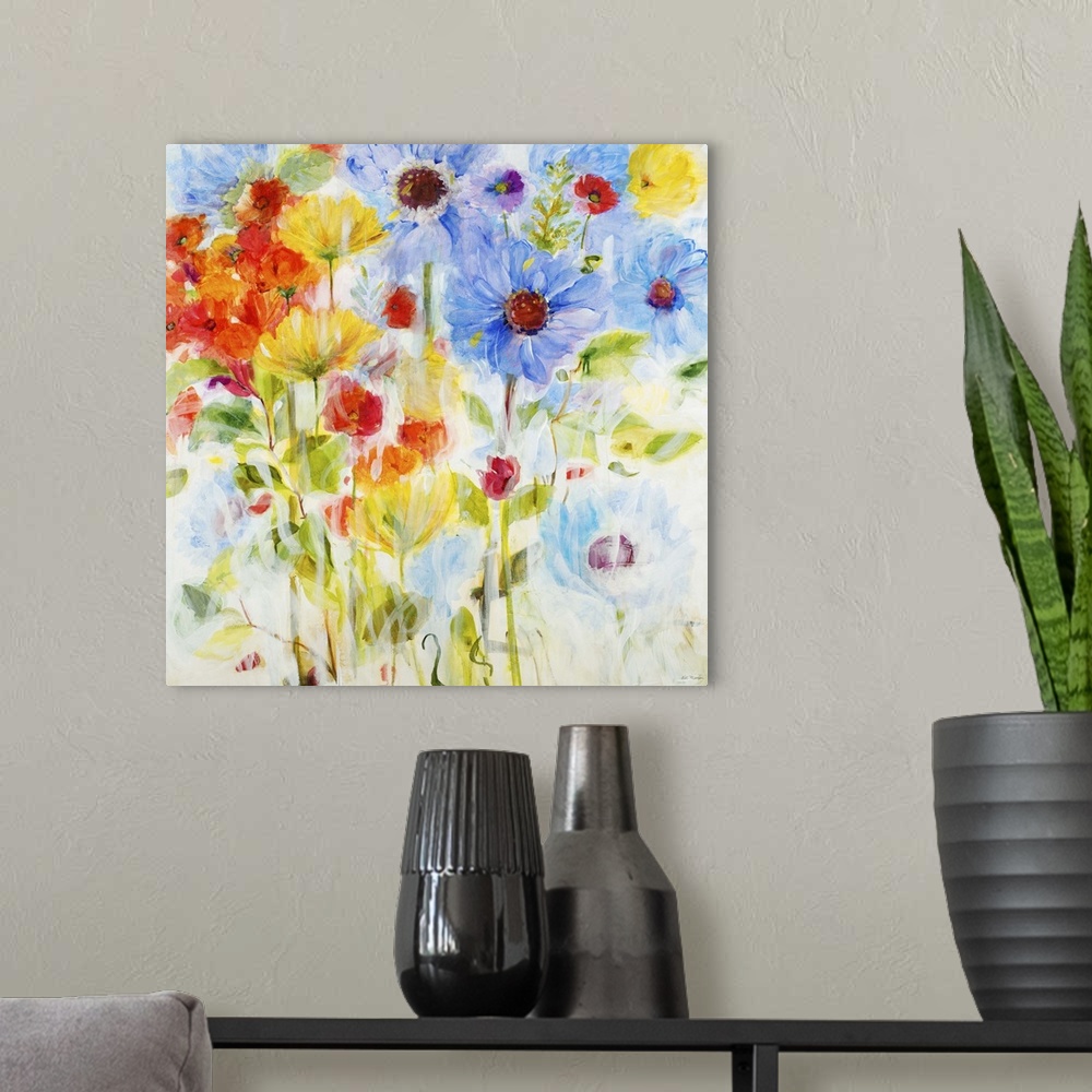 A modern room featuring Contemporary painting of vibrant blue yellow and red flowers.