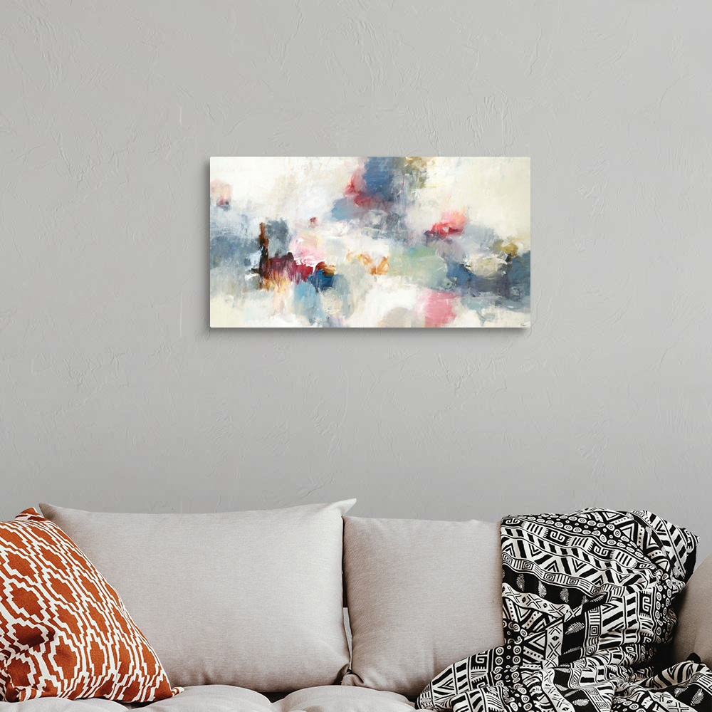 A bohemian room featuring Abstract painting made in shades of blue, red, cream, gray, yellow, and orange.