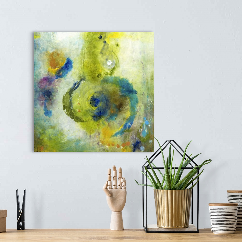 A bohemian room featuring A square abstract painting of swirled shapes in bright colored brush strokes such as green and blue.